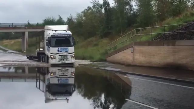 Lorry driving through flood water