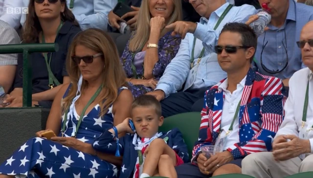A family dressed in stars and stripes