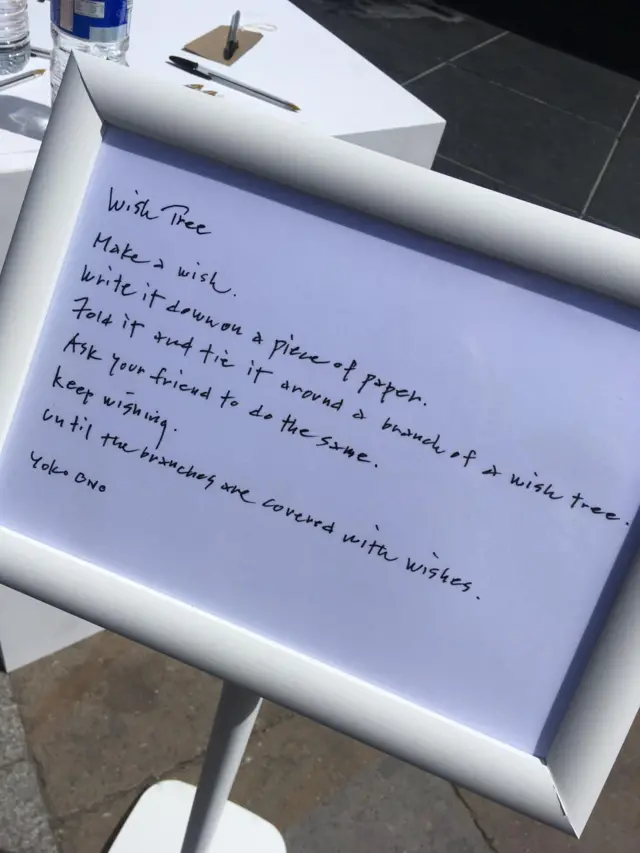 Instructions outside the Wish Trees in Manchester's Cathedral Gardens