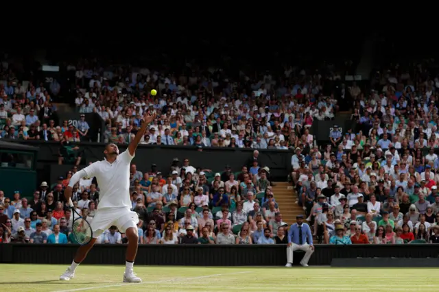 Nick Kyrgios serves