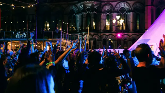 Festival Square at night, illuminated by lanterns
