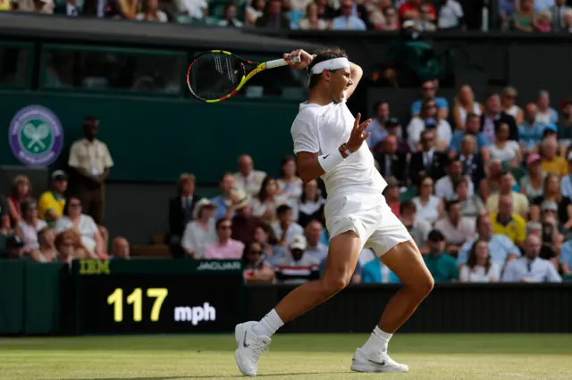 Rafael Nadal returns