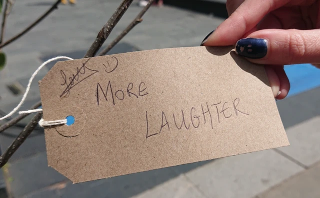 A note with I Wish For More Laughter written on it