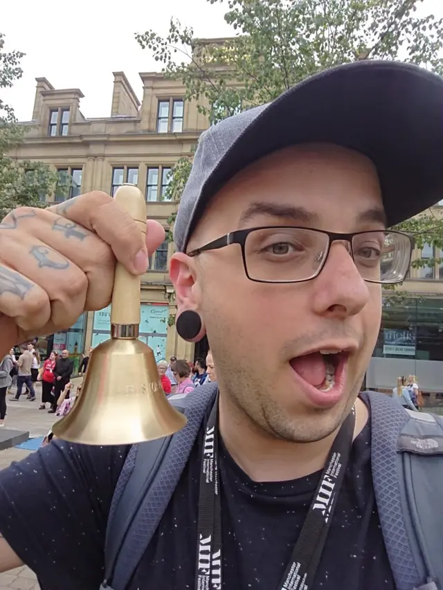 Dan Hett with a bell