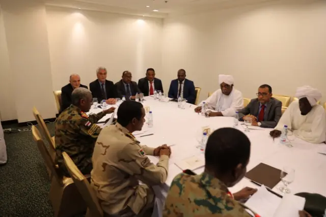 Representatives of the Transitional Military Council and the Freedom and Change opposition attend negotiations mediated by the African Union and Ethiopian special envoy in Khartoum, Sudan, 3 July 2019