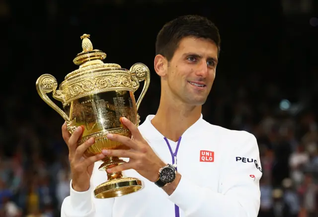 Novak Djokovic with the Wimbledon men's singles trophy