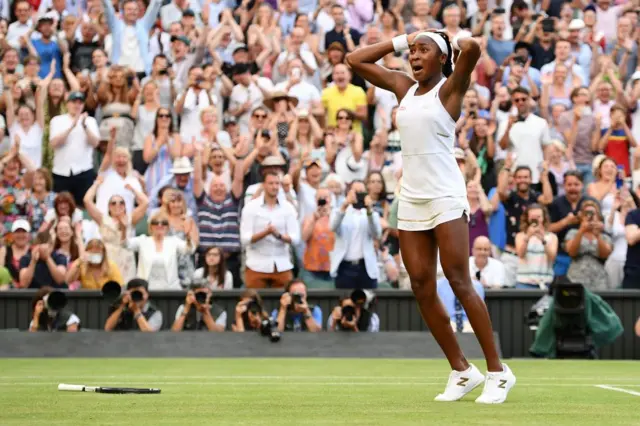 Coco Gauff has her hands on her head in disbelief