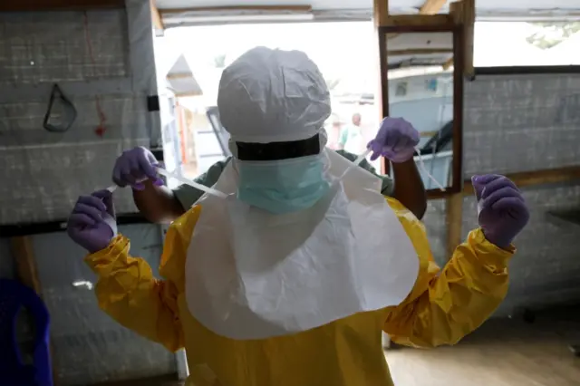 Health worker wearing protective gear