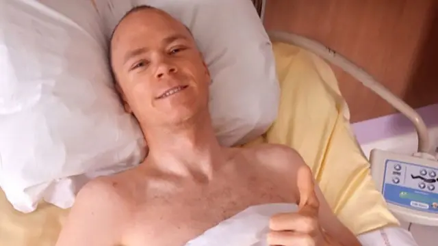 Chris Froome pictured smiling while recovering in hospital