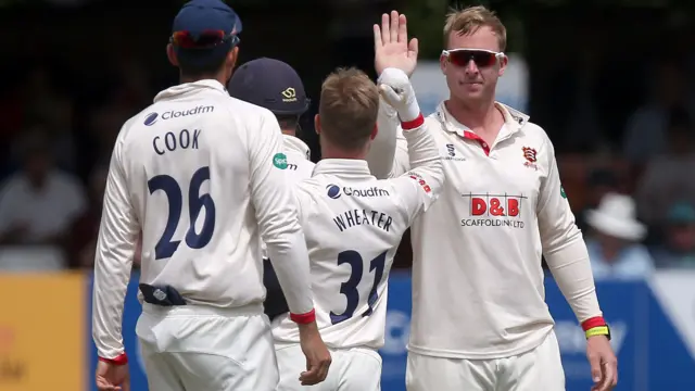 Simon Harmer of Essex celebrates with his team mates after taking the wicket of Tom Kohler-Cadmore