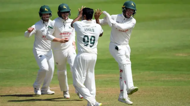 Tom Moores and Ravichandran Ashwin of Nottinghamshire celebrate the wicket of Tom Abell of Somerset