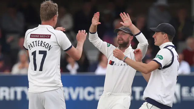 Steve Patterson celebrates getting the wicket of Alastair Cook