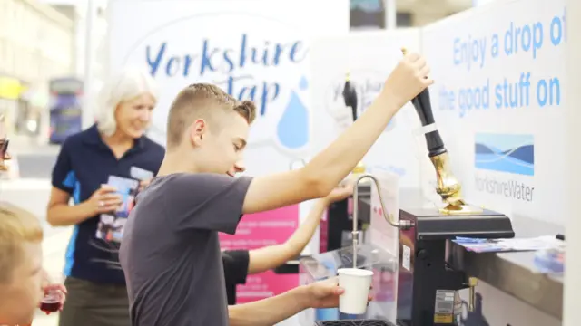 A man pulling water