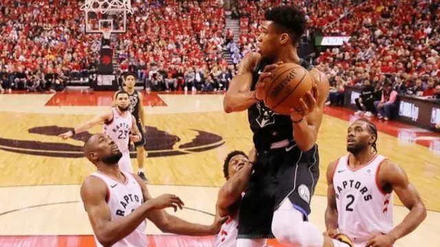 Giannis Antetokounmpo in action for Bucks v Raptors