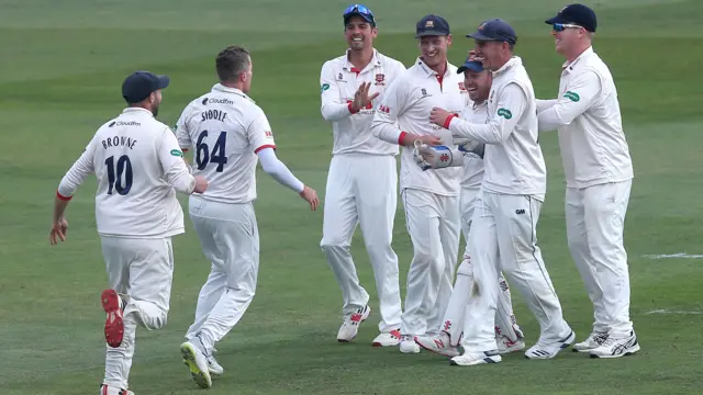 Peter Siddle runs to celebrate with Essex keeper Adam Wheater after a spectacular catch