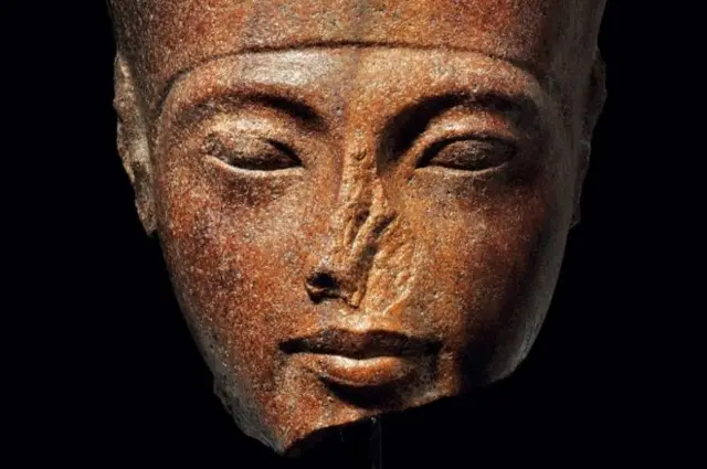 The 3,000-year-old, brown quartzite head of Tutankhamun was part of a statue of the God Amun