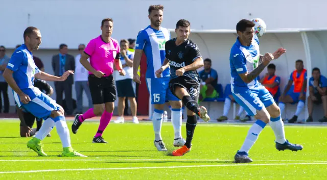 Jordan Jones has a shot charged down as Rangers press for the opening goal