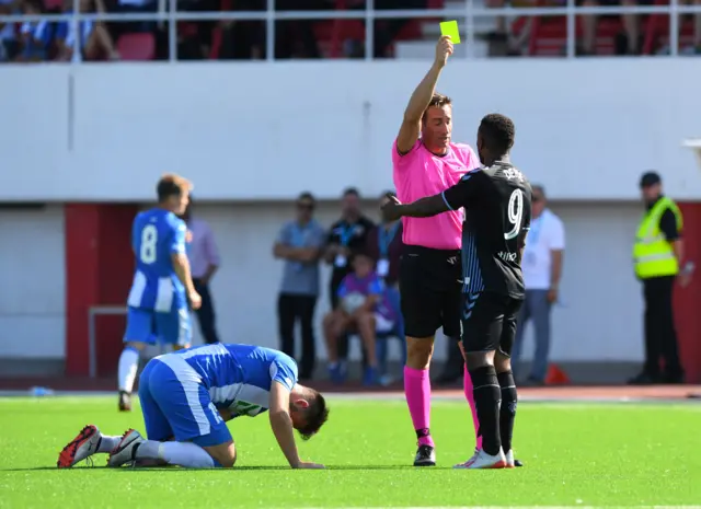 Jermain Defoe is booked for a late challenge