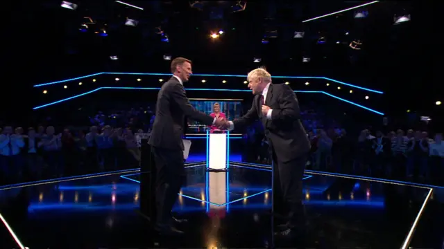 Jeremy Hunt and Boris Johnson shake hands