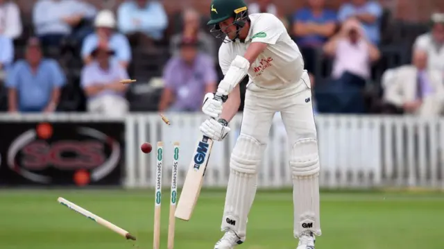 Jake Ball is bowled by Jamie Overton