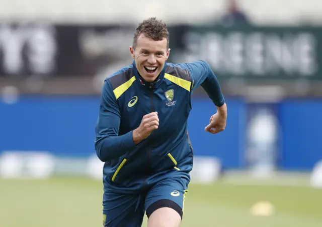 Peter Siddle of Australia warms up