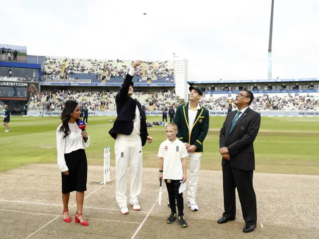 Joe Root of England and Tim Paine of Australia toss the coin during Day One of the 1st Specsavers Ashes Test between England and Australia