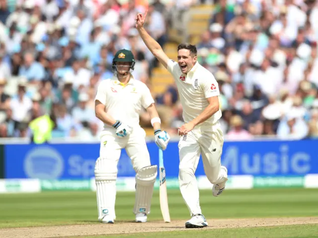 Chris Woakes celebrates taking the wicket of Australia's Usman Khawaja