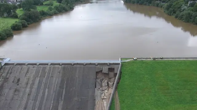 An aerial picture shows the damage to the Toddbrook Reservoir dam in Whaley Bridge