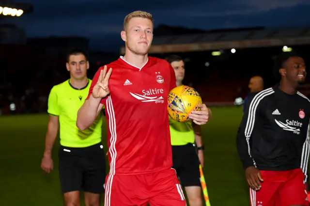 Aberdeen striker Sam Cosgrove fired a hat-trick in the mauling of Chikhura