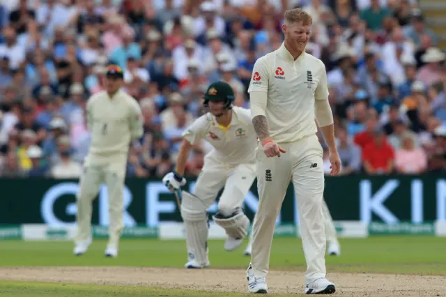 England's Ben Stokes (R) reacts as Australia's Steve Smith runs between wickets