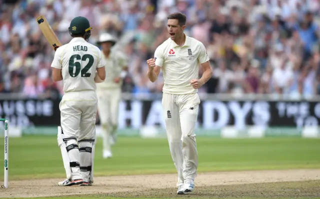 Chris Woakes celebrates trapping Travis Head lbw