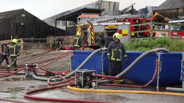 A firefighter inspects a generator