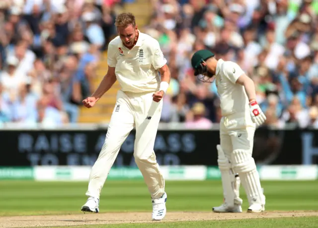 England's Stuart Broad celebrates the wicket of Australia's David Warner