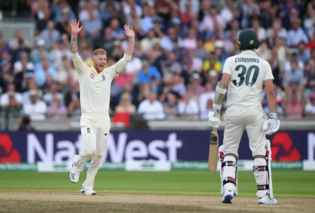 Ben Stokes celebrates after dismissing Pat Cummins