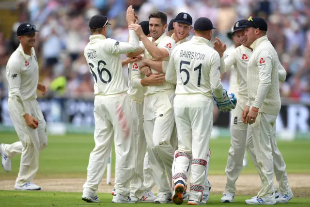 Chris Woakes of England celebrates dismissing Travis Head of Australia