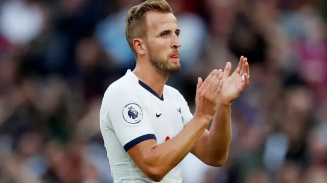 Harry Kane applauds the fans at full time