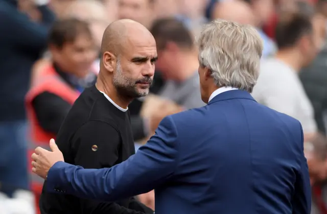 Pep Guardiola shakes hands with West Ham manager Manuel Pellegrini