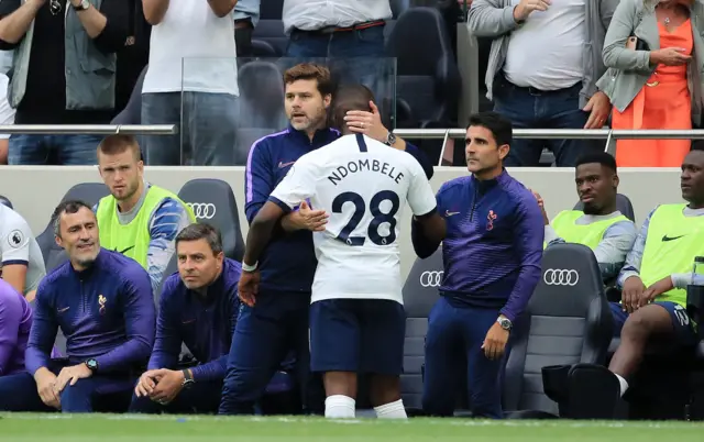 Tanguy Ndombele is hugged by new boss Mauricio Pochettino