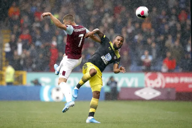 Burnley's Johann Berg Gudmundsson and Southampton's Ryan Bertrand clash