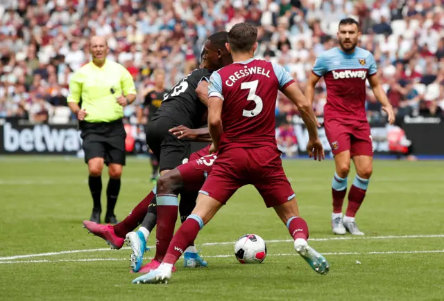 Riyad Mahrez is fouled in the West Ham box by Issa Diop