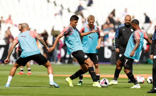 New signing Rodri and Raheem Sterling compete for the ball in the Man City warm-up