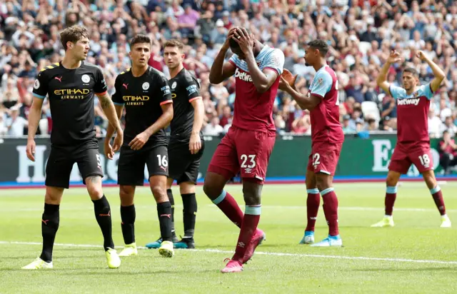 Issa Diop has his head in his hands after missing a chance