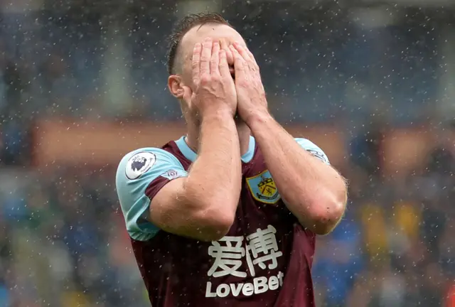 Ashley Barnes puts his head in his hands