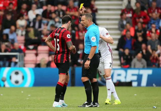 Adam Smith shown a yellow card