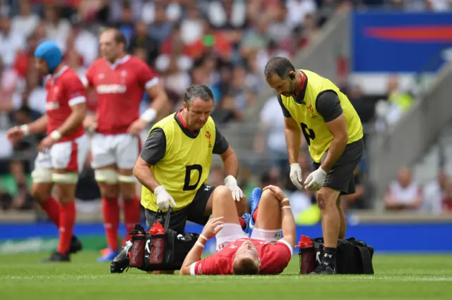 Gareth Ainscombe is treated by medical staff