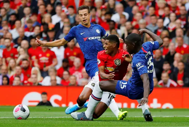 Kurt Zouma fouls Marcus Rashford in the Chelsea penalty area