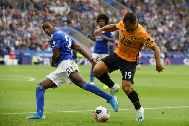 Jonny Otto of Wolverhampton Wanderers battles for possession with Ricardo Pereira of Leicester City