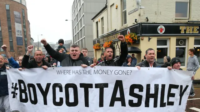 Fans protest against Newcastle United owner Mike Ashley at St. James' Park