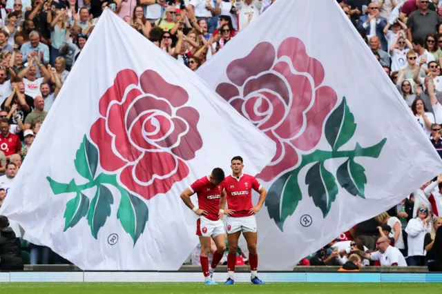 Josh Adams and Owen Watkin of Wales react following defeat