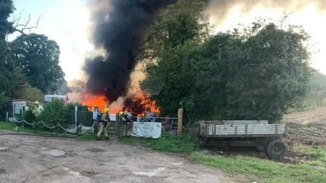 Flames and smoke from building